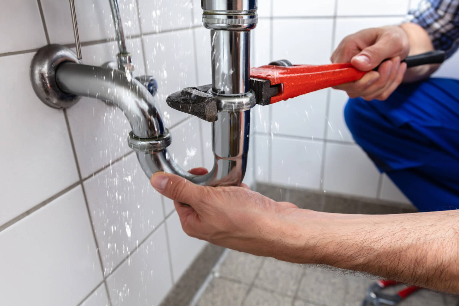Licensed Custom Fit Plumbing technician repairing a leaking waterline pipe in Eaton, Ohio